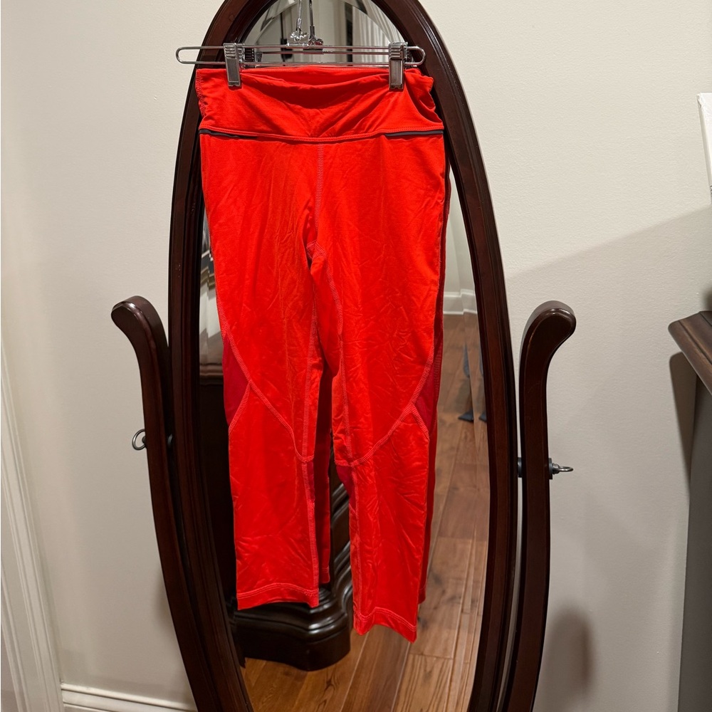 ALALA Fiery Red Cropped Athletic Leggings With Mesh Cutouts